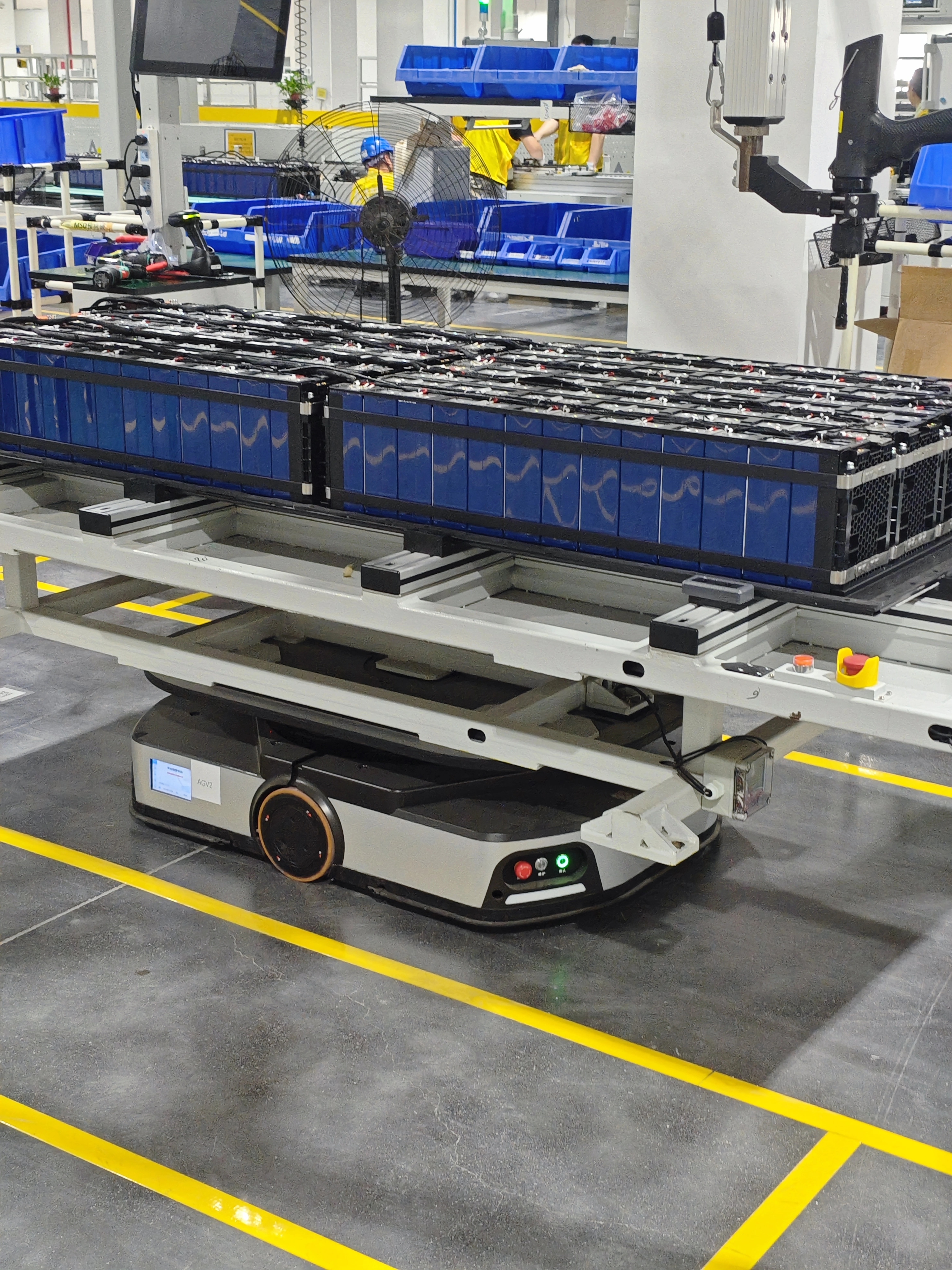 Battery modules transported by an automated guided vehicle in a modern manufacturing facility
